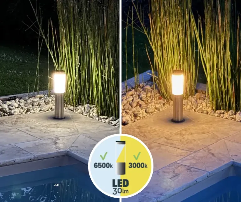 Solar light discreetly integrated into a plant bed near a wooden pool deck, harmonious outdoor lighting.