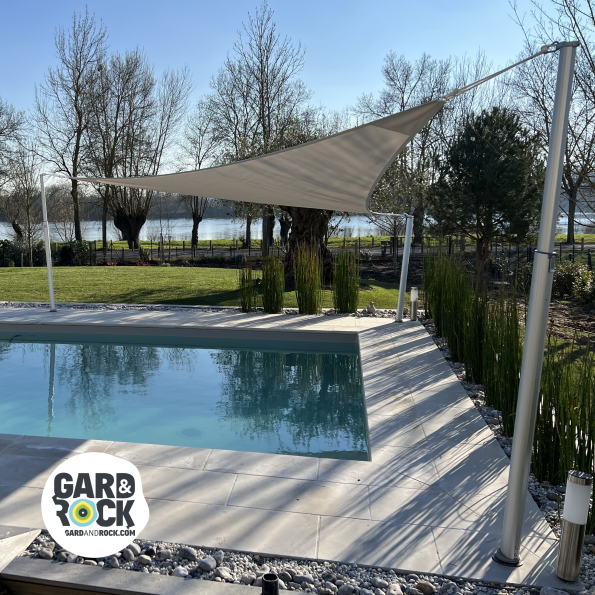Shade sail mast around swimming pool