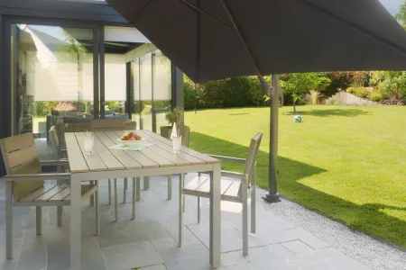 Mobile base for offset parasol, lightweight support without heavy slabs, designed for more flexible landscape setups.